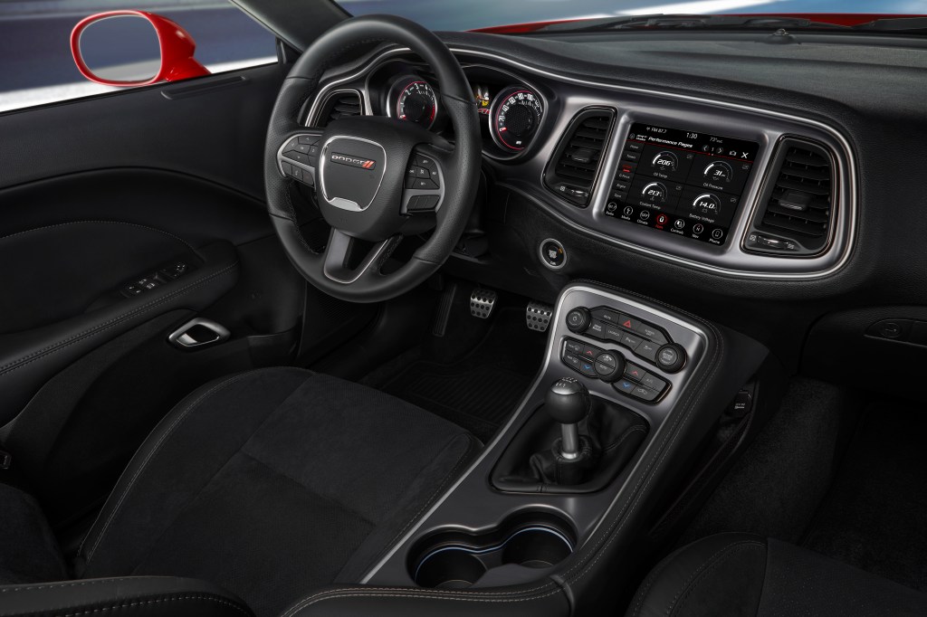 The interior of a 2019 Dodge Challenger R/T Scat Pack Widebody, showing the 6-speed manual