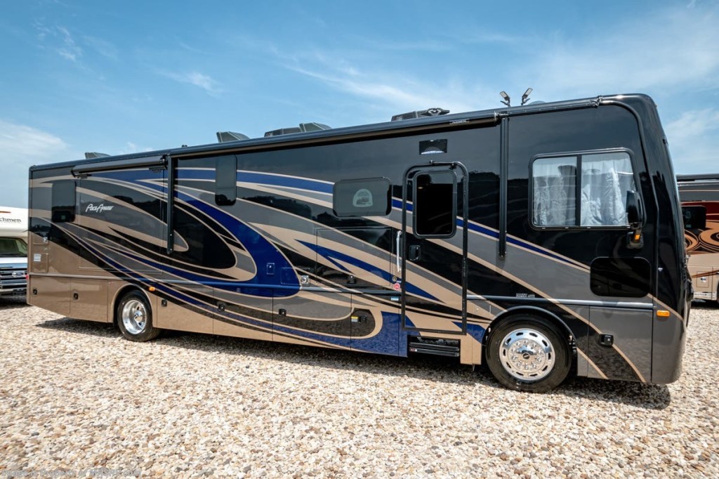 A large bus-like black motorhome with gray and blue swirl stripes.