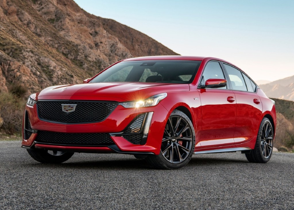 A red 2020 Cadillac CT5-V parked on a mountainside road