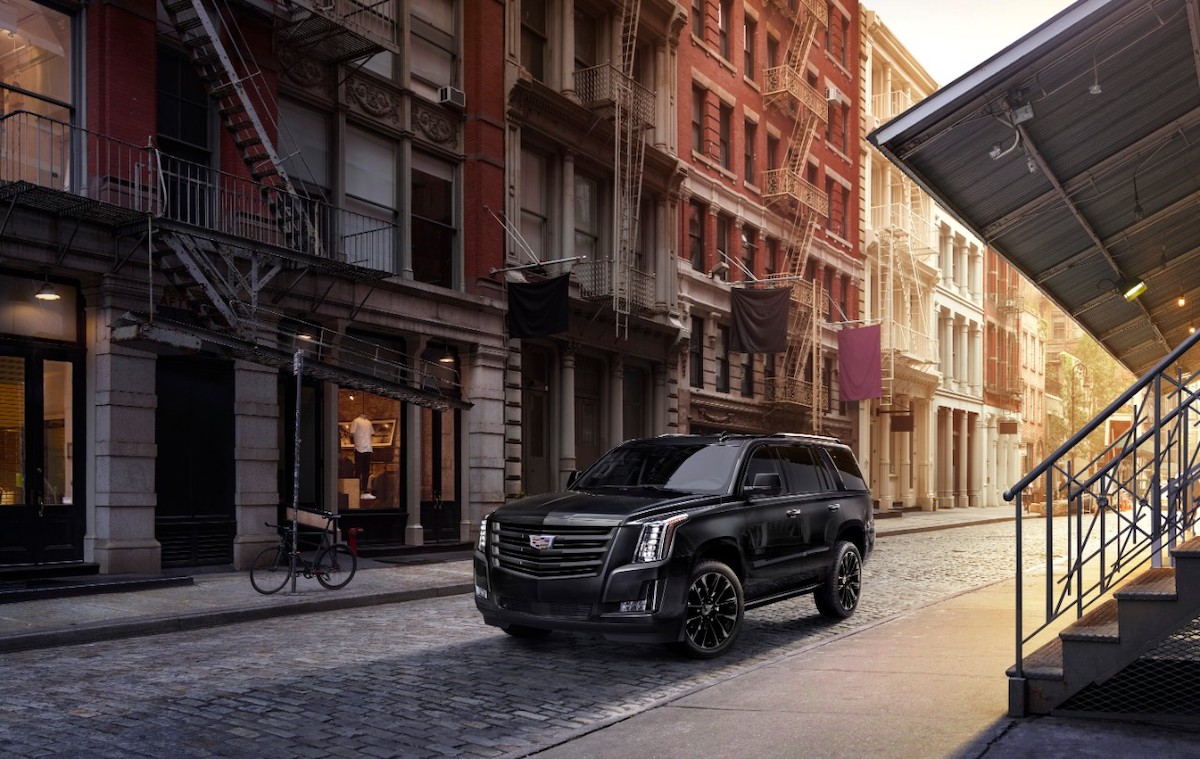 2020 Cadillac Escalade Sport Edition in the city parked next to an apartment building