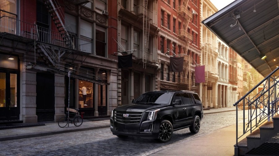 2020 Cadillac Escalade Sport Edition in the city parked next to an apartment building
