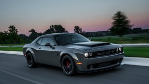 Dodge Challenger SRT Demon driving at sunset