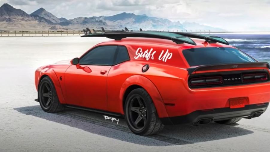 A red Dodge Challenger with surfboards on top is rendered as a two-door shooting brake concept on a beach.