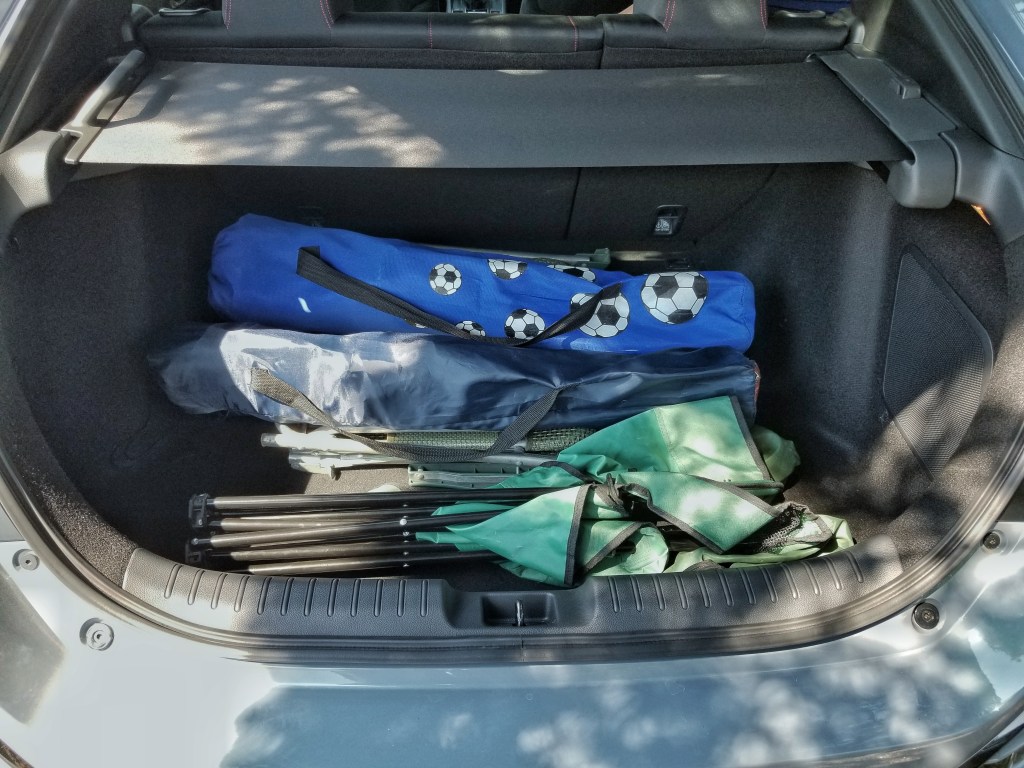 The 2020 Honda Civic Type R's trunk with 4 folding chairs