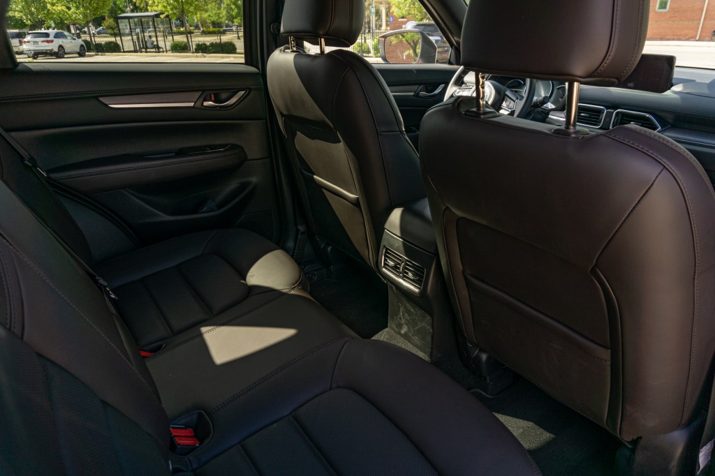 The brown Nappa leather interior of the 2020 Mazda CX-5 Signature AWD as seen from the rear seats