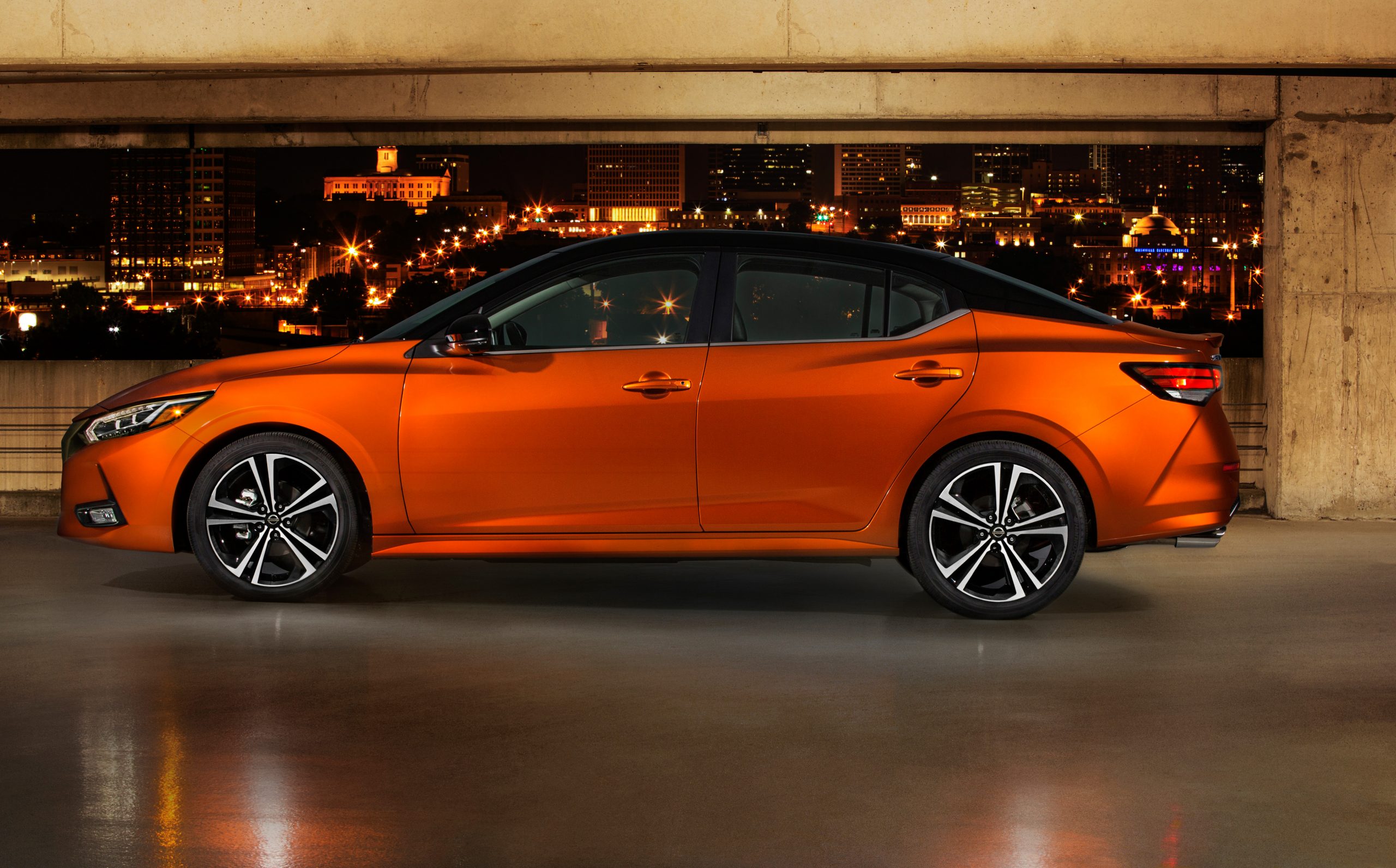 2020 Nissan Sentra with an orange glow city behind it