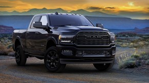 New 2020 Ram Heavy Duty Limited Black in the desert with a colorful sunset sky