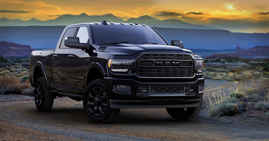 New 2020 Ram Heavy Duty Limited Black in the desert with a colorful sunset sky