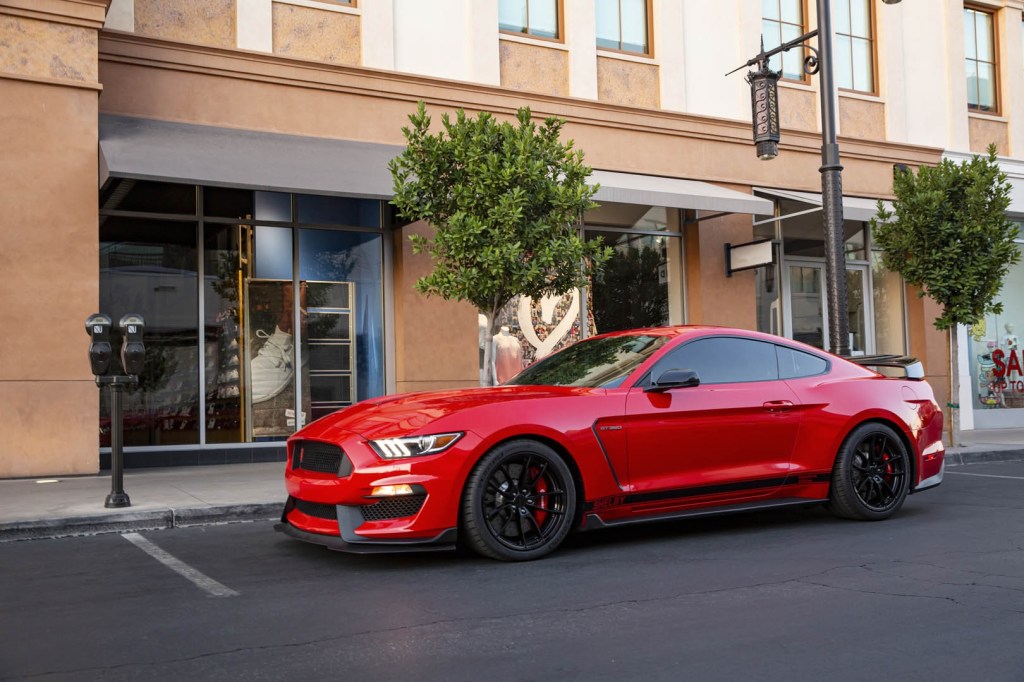 A red 2020 Shelby American Ford Mustang GT350 Anniversary Edition parked on the street