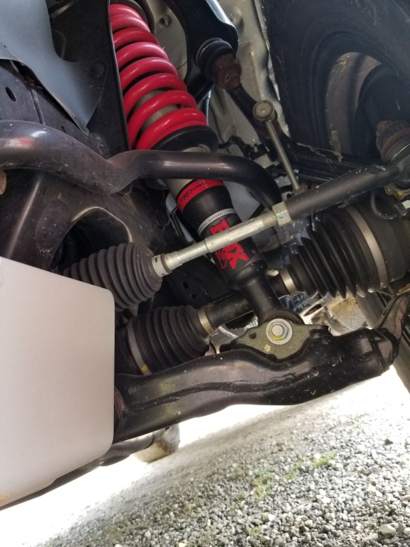 The 2020 Toyota 4Runner TRD Pro's front suspension, showing the Fox shocks and red TRD springs