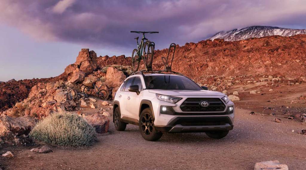 2020 Toyota RAV4 Off Road in the desert on a trail with the bike on the roof rack ready for adventure