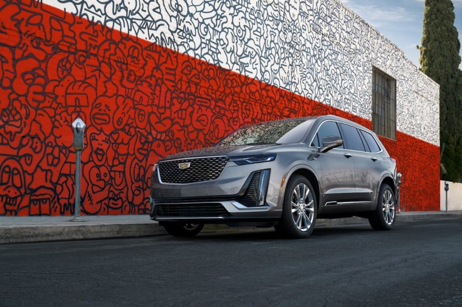 2021 Cadillac XT6 parked in front of a red and white mural painting