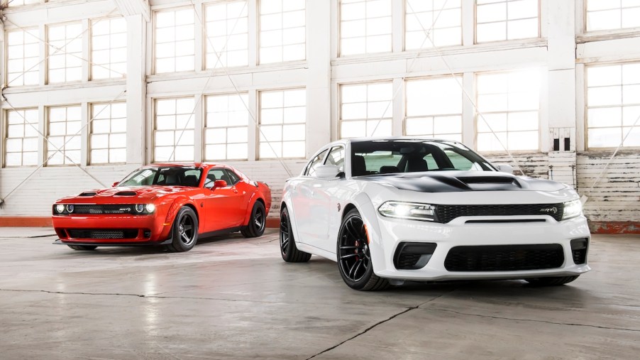 2020 Dodge Challenger and Charger parked in a hangar