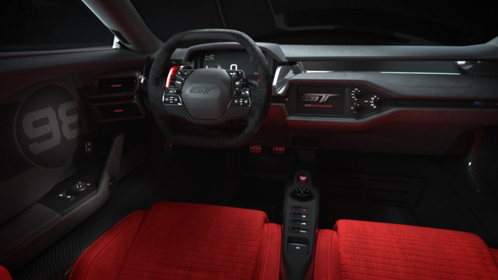 The interior of a 2021 Ford GT shows its red seats and black dash.