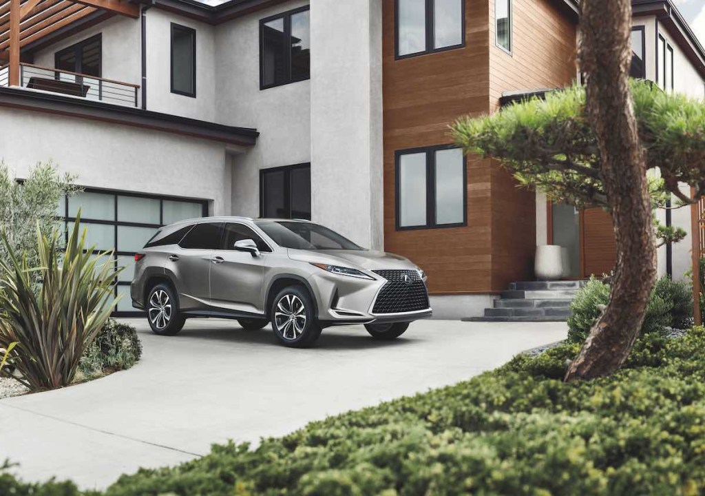 A sharp, grey 2021 Lexus RX parked on a sleek driveway.