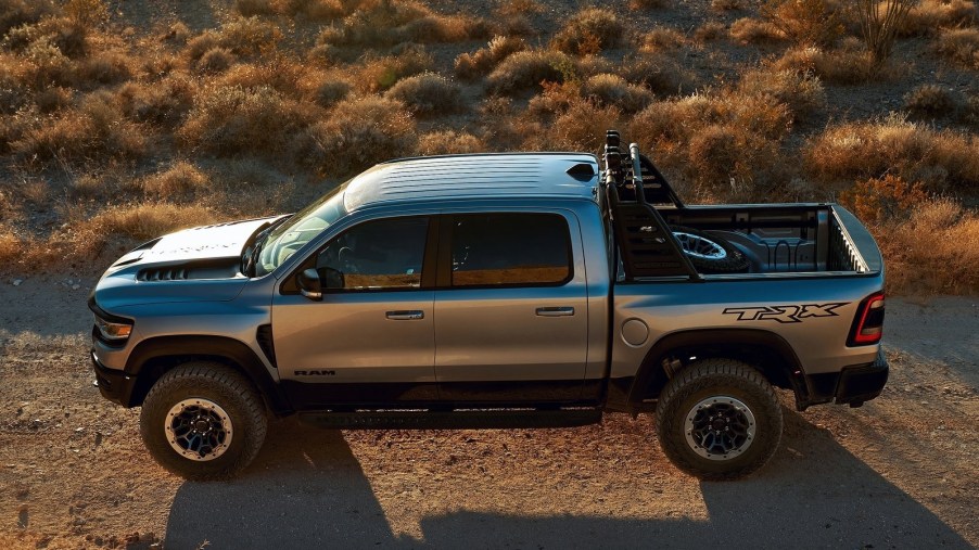 An overhead side view of a silver 2021 Ram 1500 TRX Launch Edition in the desert