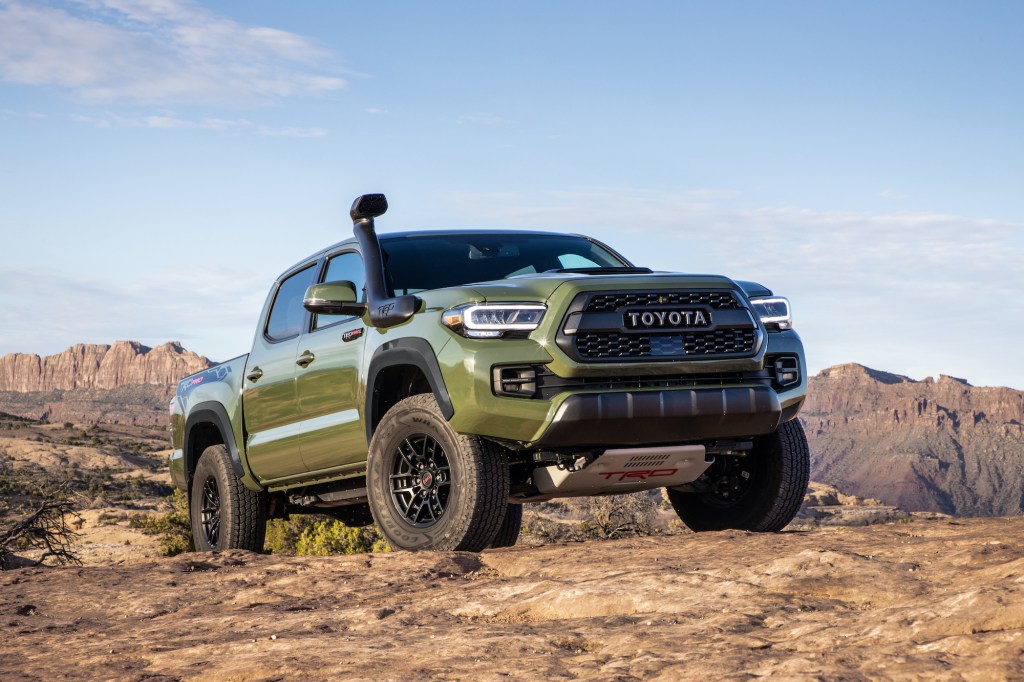 Toyota Tacoma TRD Pro off-roading in dirt is a smaller but still formidable option compared with larger trucks like the raptor