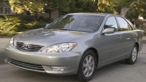 2006 Toyota Camry on a shady street is a great example of a good used car under $5,000