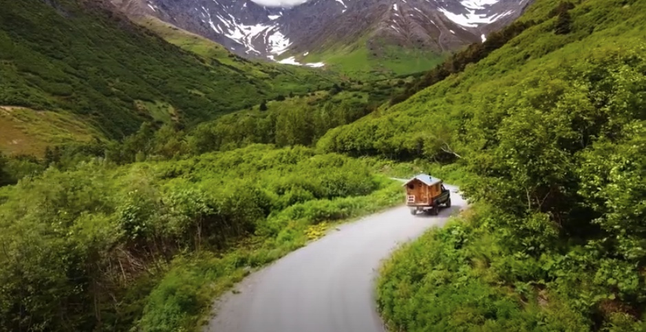 Timmy's truck camper driving on an epic Alaskan road