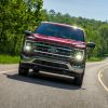 2021 Ford F-150 Lariat driving on country road