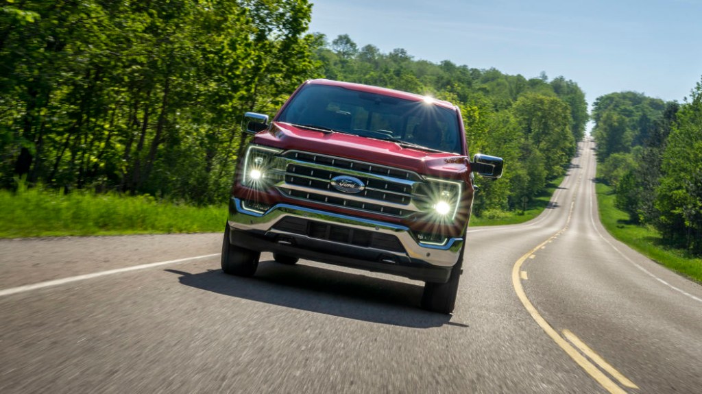 2021 Ford F-150 Lariat driving on country road
