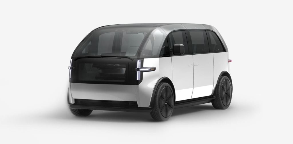 A white Canoo electric van sits in a white background.