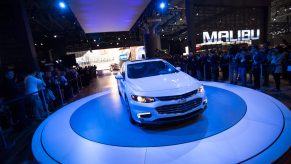 A Chevy Malibu being debuted at an auto show