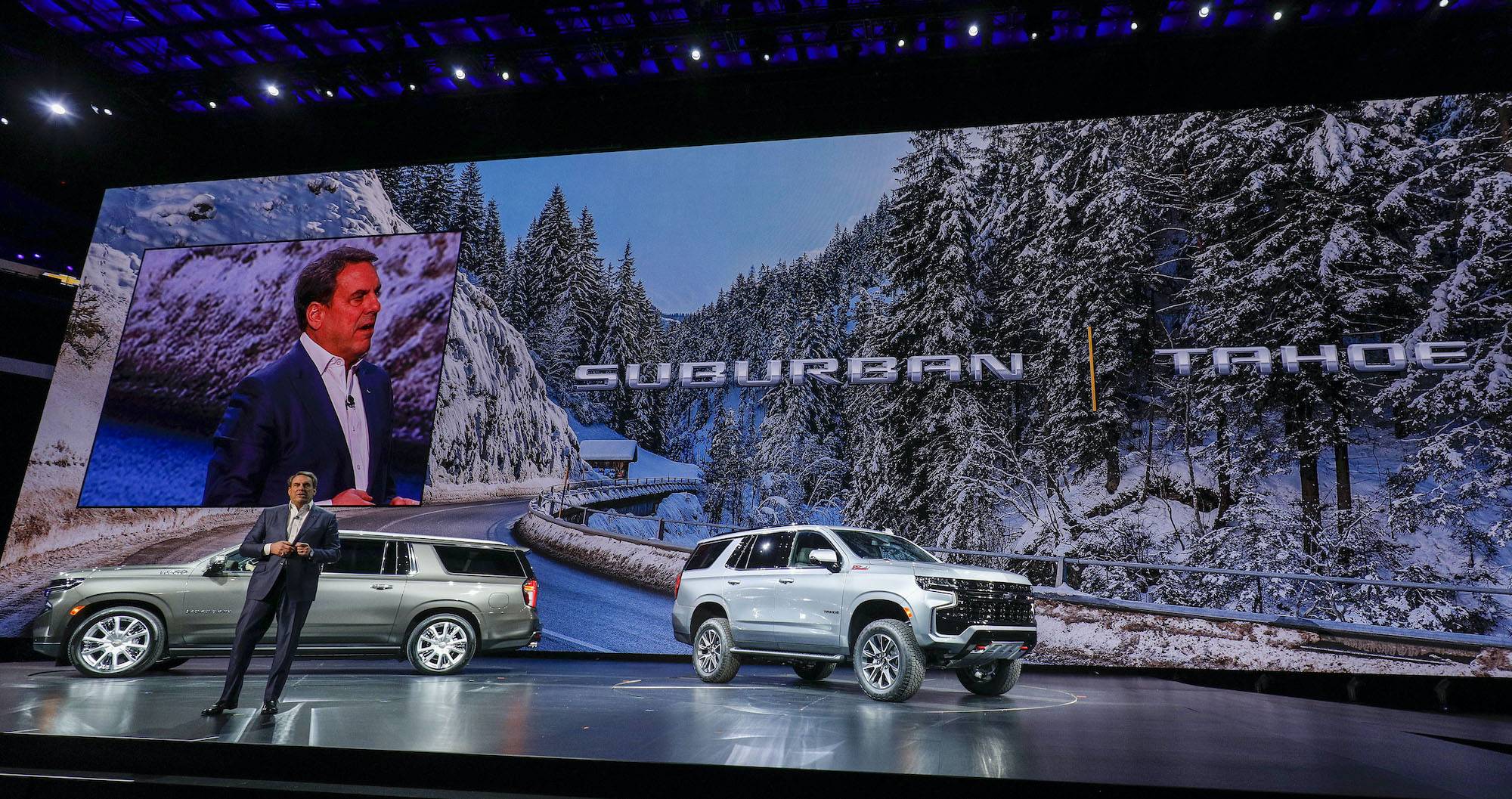 Mark Reuss, President of General Motors, talks about the new 2021 Chevrolet Suburban (left) and 2021 Chevrolet Tahoe (right) SUVs at their reveal at Little Caesars Arena