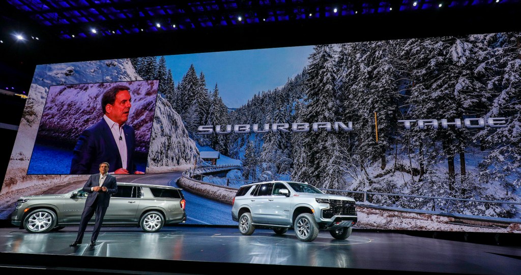 Mark Reuss, President of General Motors, talks about the new 2021 Chevrolet Suburban (left) and 2021 Chevrolet Tahoe (right) SUVs at their reveal at Little Caesars Arena