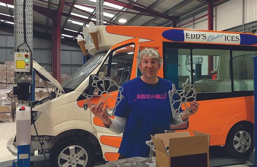 Edd China, former co-host of the Wheeler Dealer television show stands before his EV ice cream truck.