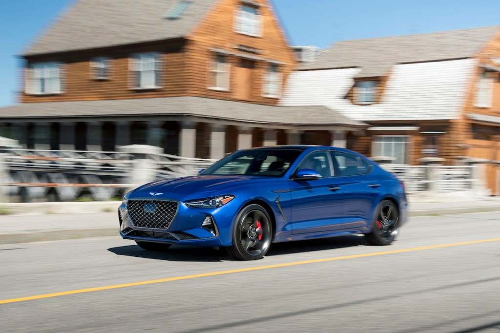 Genesis G70 driving through a city exemplifies a brand with few complaints