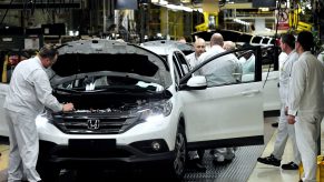 A Honda SUV being assembled in a factory