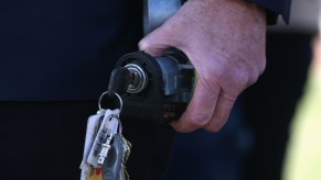 An ignition cylinder with keys attached to it has been removed from a vehicle.