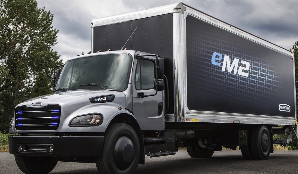 this Daimler electric semi truck is parked with its logos visible