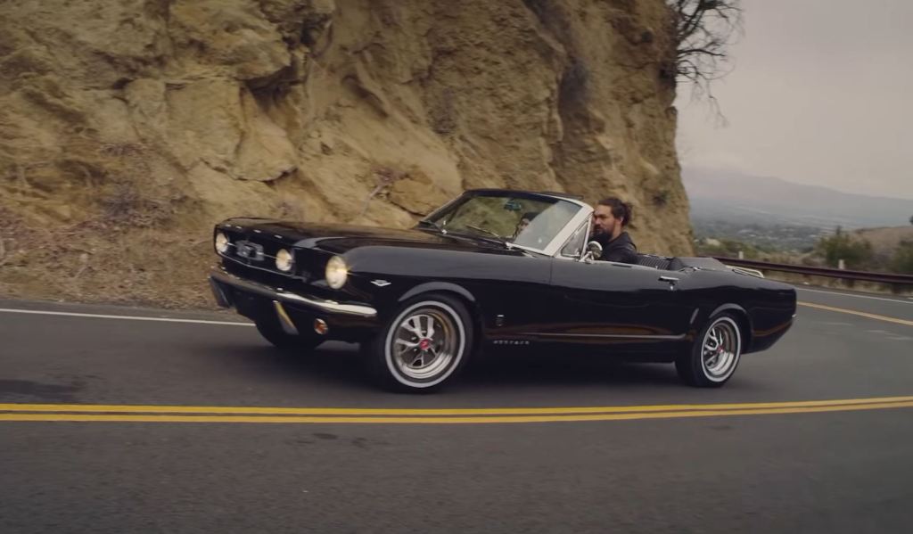 Jason Mamoa drives a black 1965 Ford Mustang GT convertible he had restored for his wife Lisa Bonet.