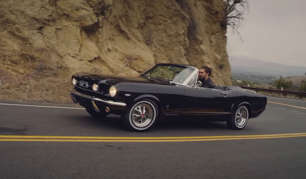 Jason Mamoa drives a black 1965 Ford Mustang GT convertible he had restored for his wife Lisa Bonet. 