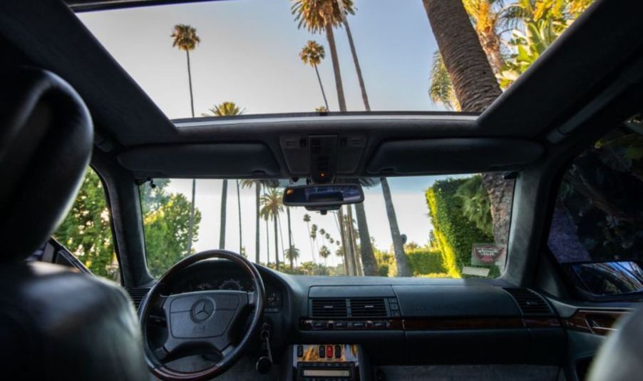 A view of the interior from the back seat forward with the sunroof open on a 1996 Mercedes S600 Loriniser coupe that formerly belonged to Michael Jordan.
