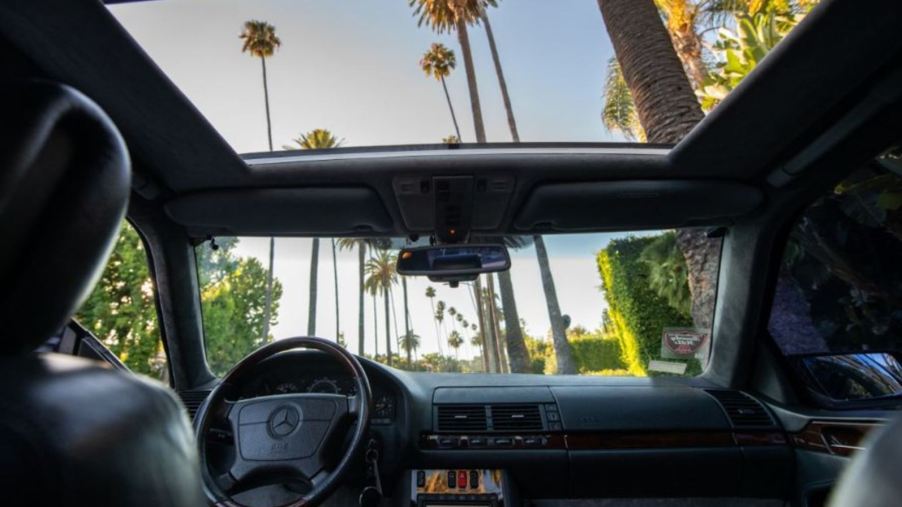 A view of the interior from the back seat forward with the sunroof open on a 1996 Mercedes S600 Loriniser coupe that formerly belonged to Michael Jordan.