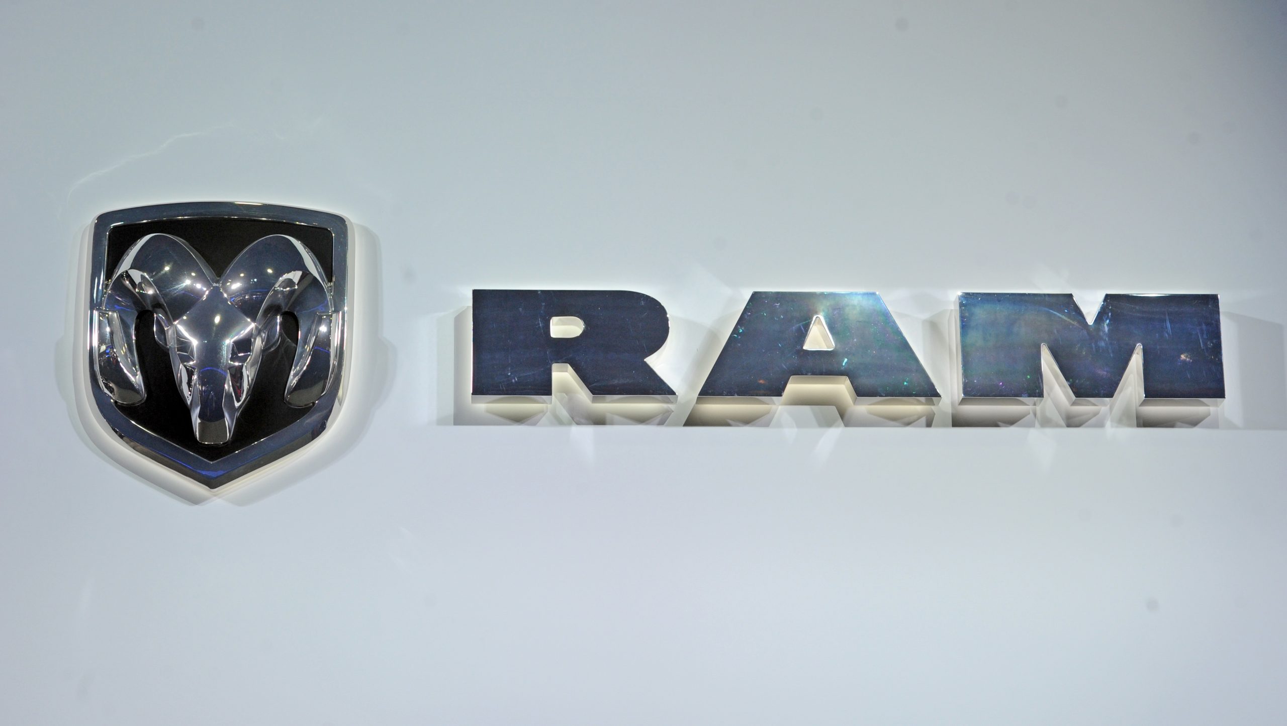 A Ram logo at an auto show