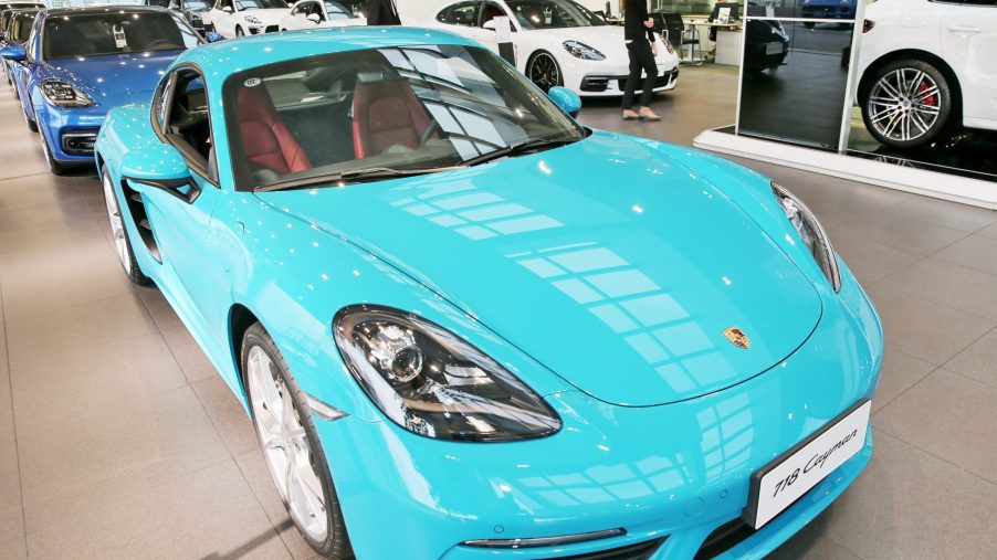 A light blue Porsche 718 Cayman on display