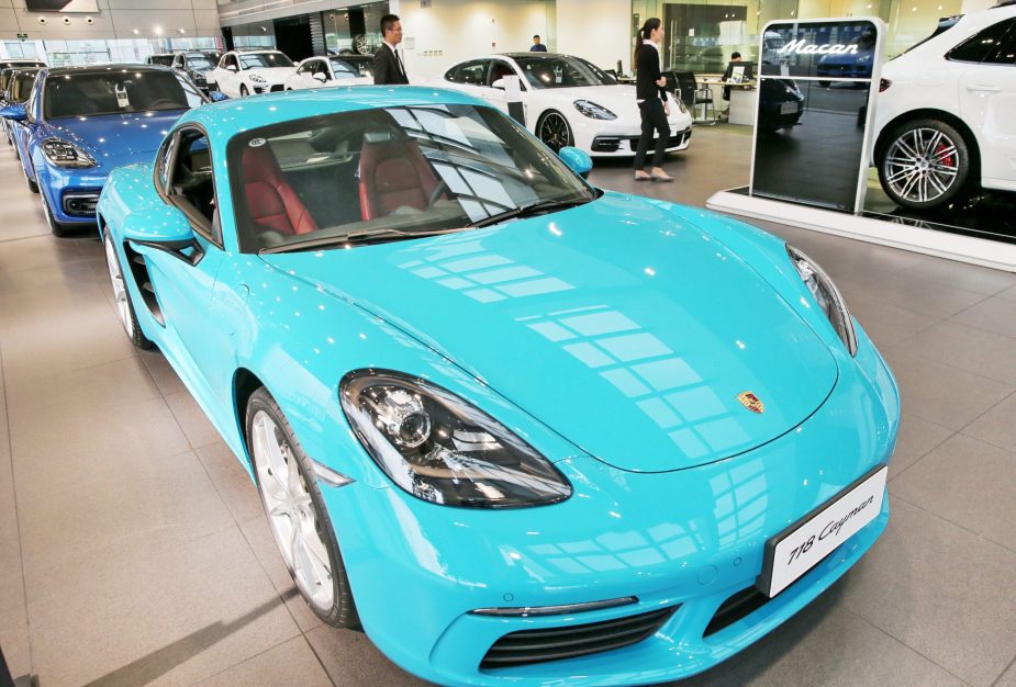 A light blue Porsche 718 Cayman on display