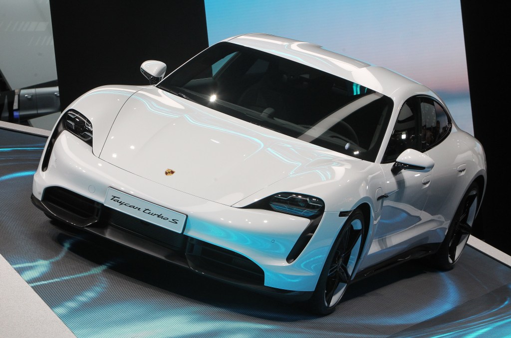 A Porsche Taycan Turbo S on display at an auto show