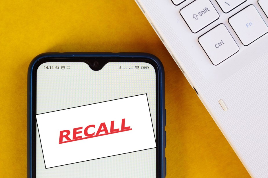 The word, RECALL, is displayed on a smartphone.