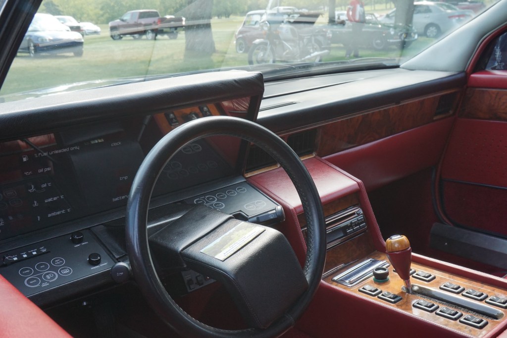 The red-leather interior of an S2 Aston Martin Lagonda, showing the digital dashboard
