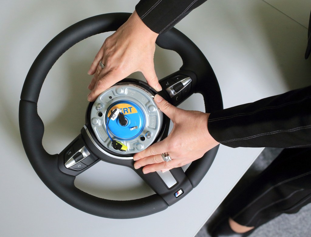 A steering wheel igniter is shown in the center of a steering wheel.