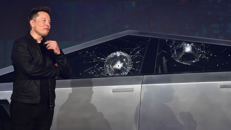 Tesla co-founder and CEO Elon Musk verbally reacts in front of the newly unveiled all-electric battery-powered Tesla Cybertruck with broken glass on windows following a demonstration that did not go as planned