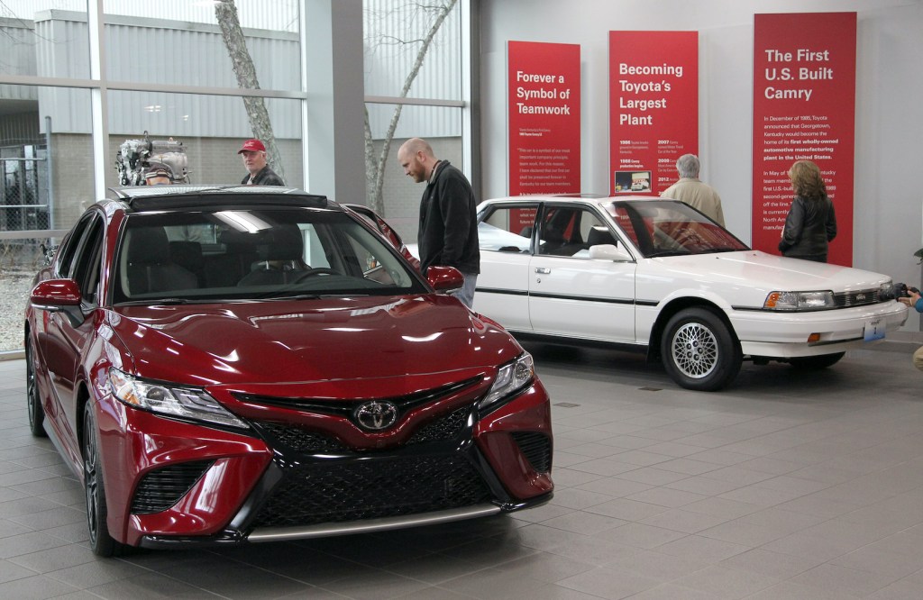 Visitors to the Toyota Motor Manufacturing plant look over the 2019 Toyota Camry, competing with the Honda Accord, at the Georgetown plant as they wait for the unveiling of the new 2019 Toyota RAV4 Hybrid
