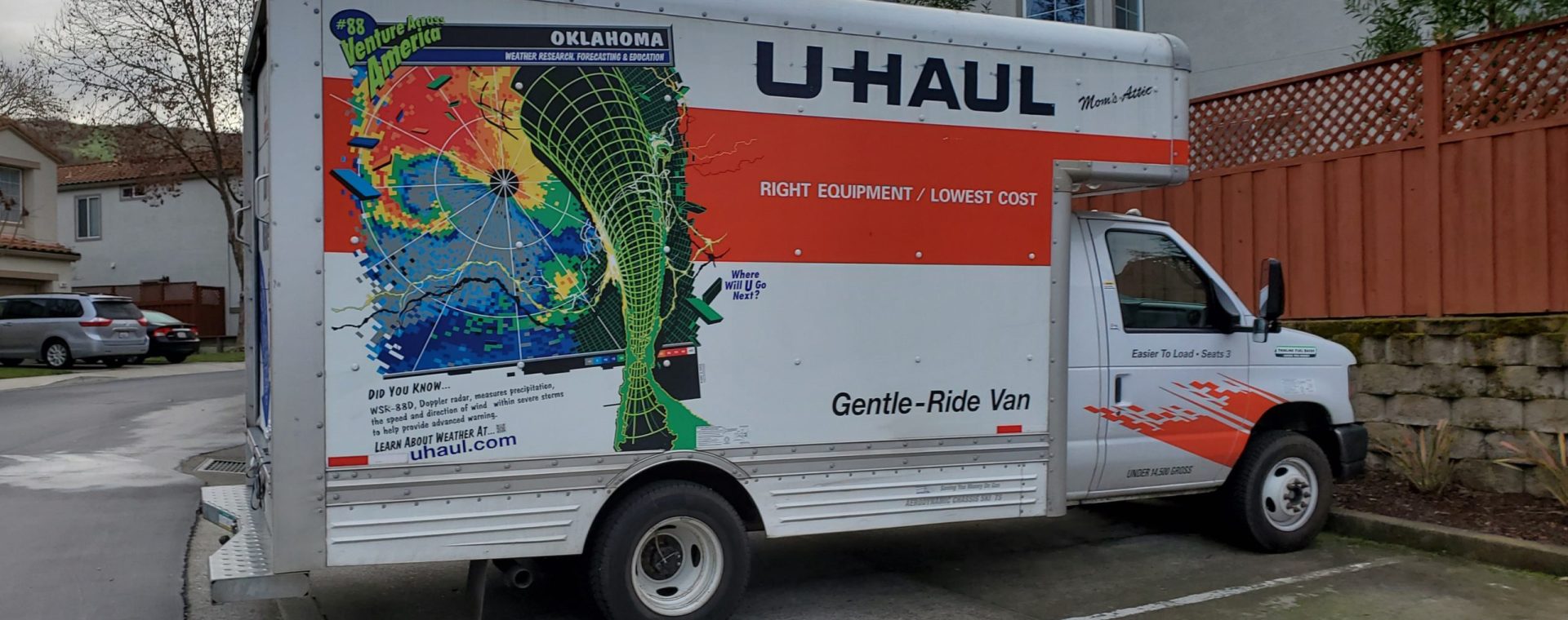 A U-Haul box truck is seen parked in a residential neighborhood.