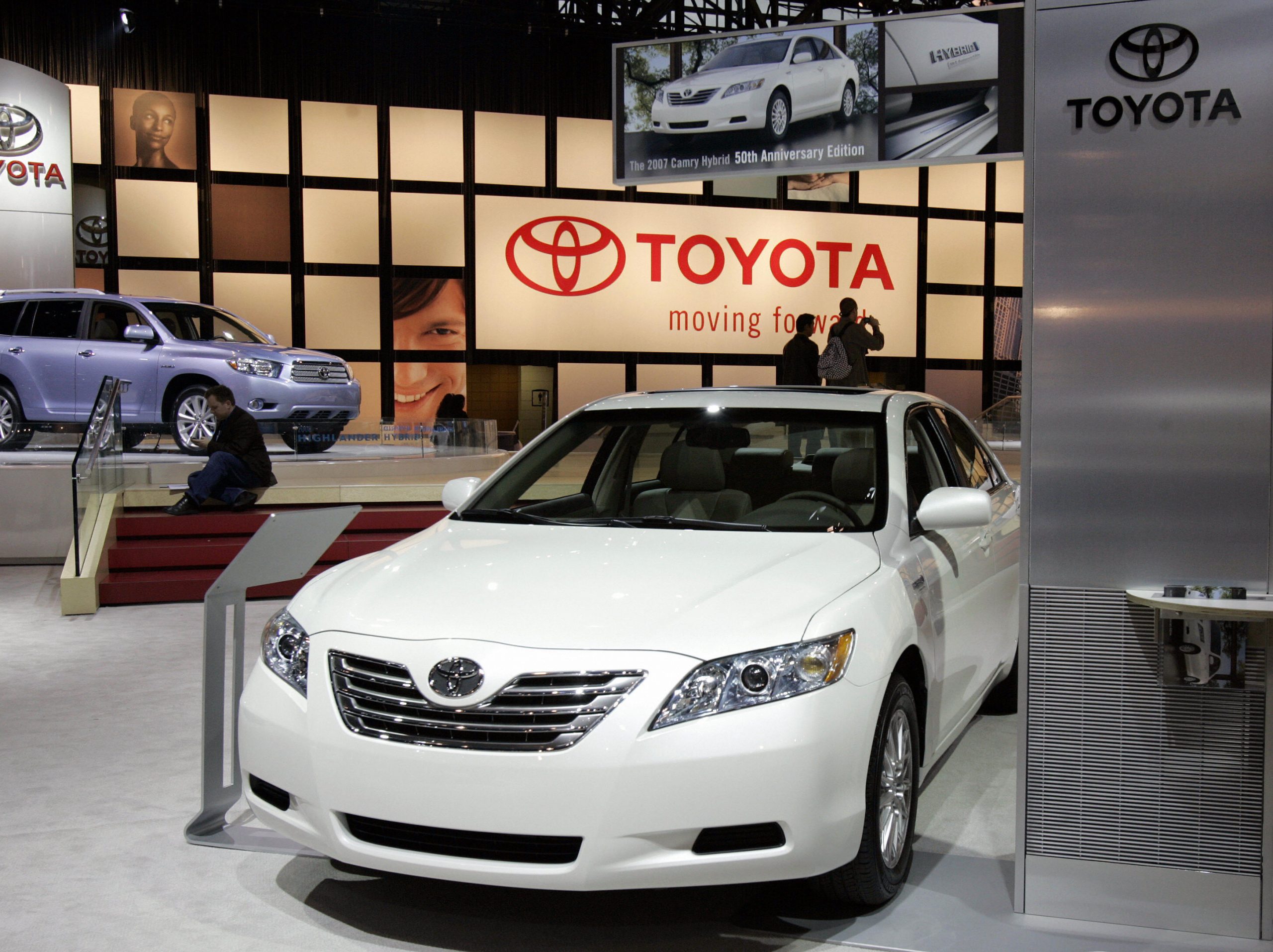 A white Toyota Corolla on display at an auto show