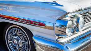 The right front corner of a Ford Galaxie is shown in close up the same car the Manson family used